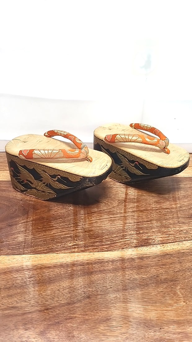 Japanese Lacquered Platform Geta Sandals, Crane Motif, Orange Brocade Straps: 8.5 x 3.5 x 9.5 2.4 lb Low Estimate: 20.00 High Estimate: 120.00