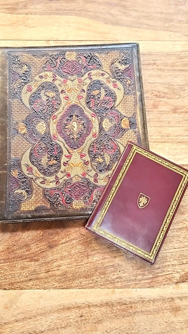 Italian Hand Tooled Leather Bifold Photo Albums Frames. Vintage: 11 x 14 x 1 2.5 lb Low Estimate: 15.00 High Estimate: 65.00