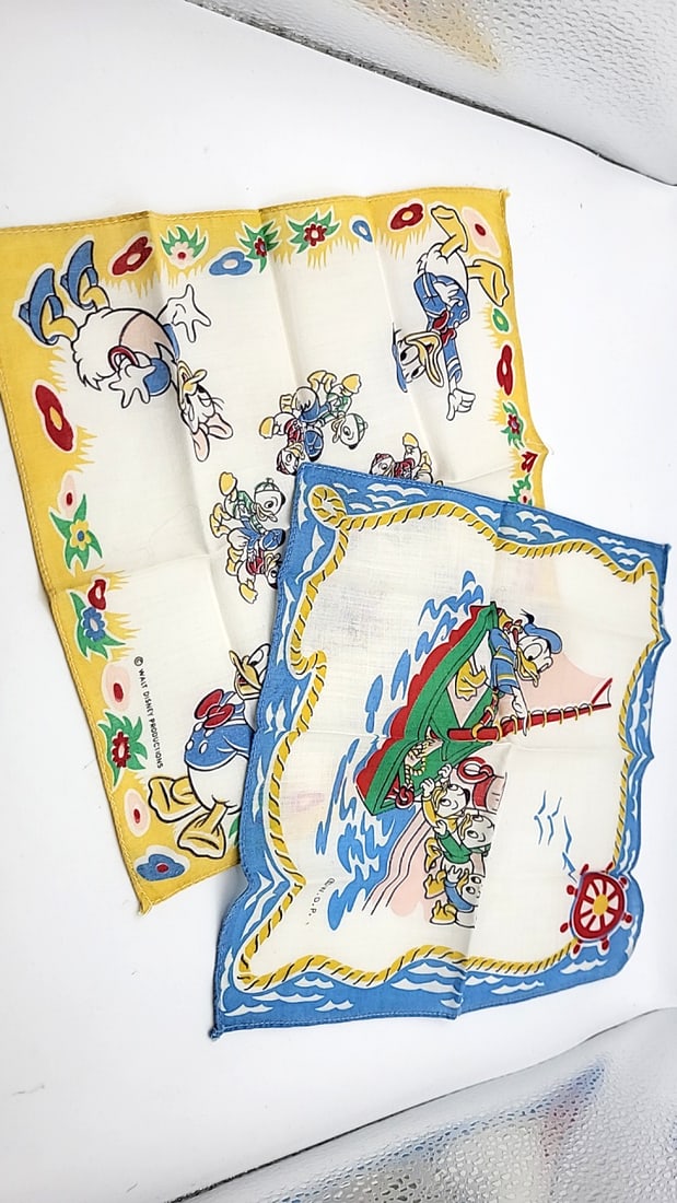 Walt Disney Productions Donald Duck Daisy Huey Dewey Louie Handkerchiefs Lot of 2: No visible staining or holes 10 x 10 x 0.1 0.05 lb Low Estimate: 8.00 High Estimate: 35.00