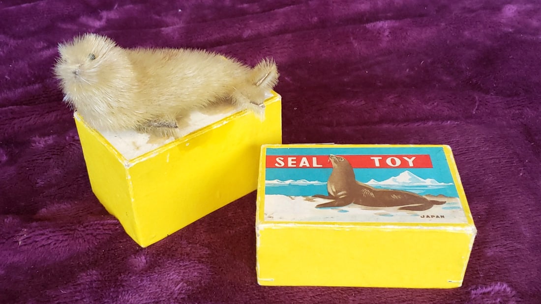 Seal Toy Japan Fur-Covered Seal Figure with Yellow Box: 4x3x3 1lb Low Estimate: 10.00 High Estimate: 75.00