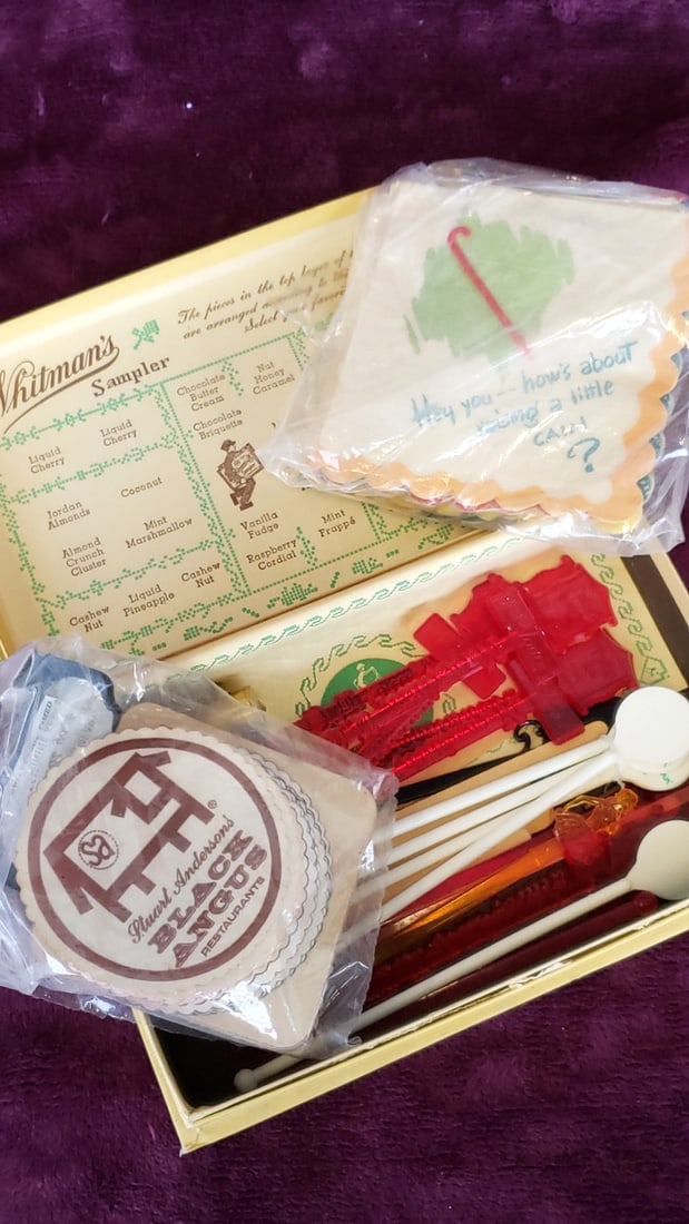 Whitman's Sampler Chocolate Confections Box with Vintage Cocktail Stirrers & Restaurant Coasters: 9x6x2 1lb Low Estimate: 10.00 High Estimate: 35.00