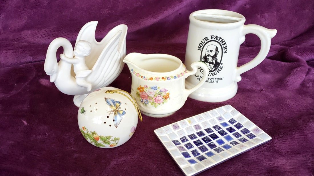 Assorted Ceramic Decor Lot: Your Father's Mustache New Orleans Mug, Floral Creamer, Mosaic Tray: 10x6.5x6.5 3lb Low Estimate: 8.00 High Estimate: 35.00