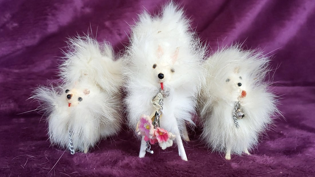 Lot of 3 White Faux Fur Dog Figurines with Chain and Flower Accents: 6x4x3 1lb Low Estimate: 5.00 High Estimate: 30.00
