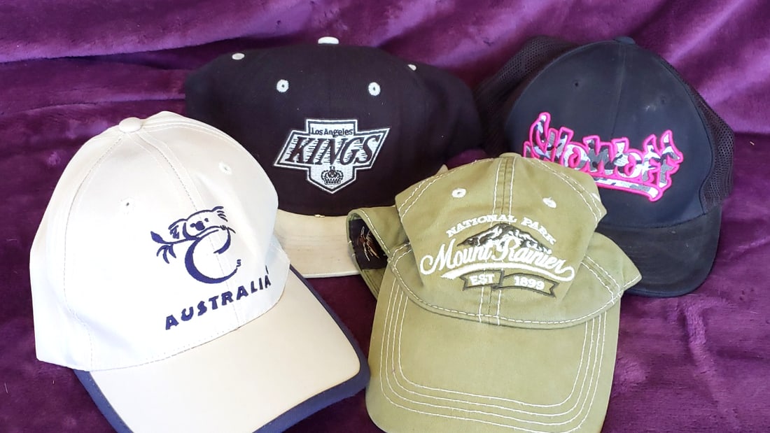 Lot of 4 Embroidered Baseball Caps: Australia Koala, Los Angeles Kings, Mount Rainier, Snowboard: 11x7x5 1lb Low Estimate: 10.00 High Estimate: 40.00