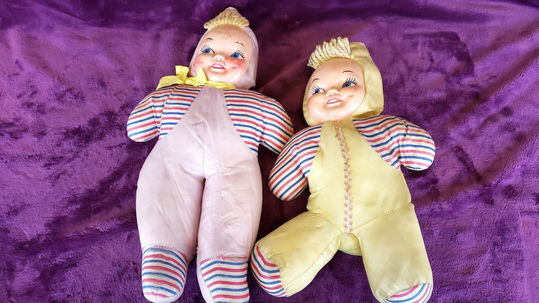 Pair of Rubber Face Cloth Carnival Prize Baby Dolls in Striped Pajamas and Bonnets, 16 in: 18 x 17 x 4 1.5 lb Low Estimate: 10.00 High Estimate: 90.00