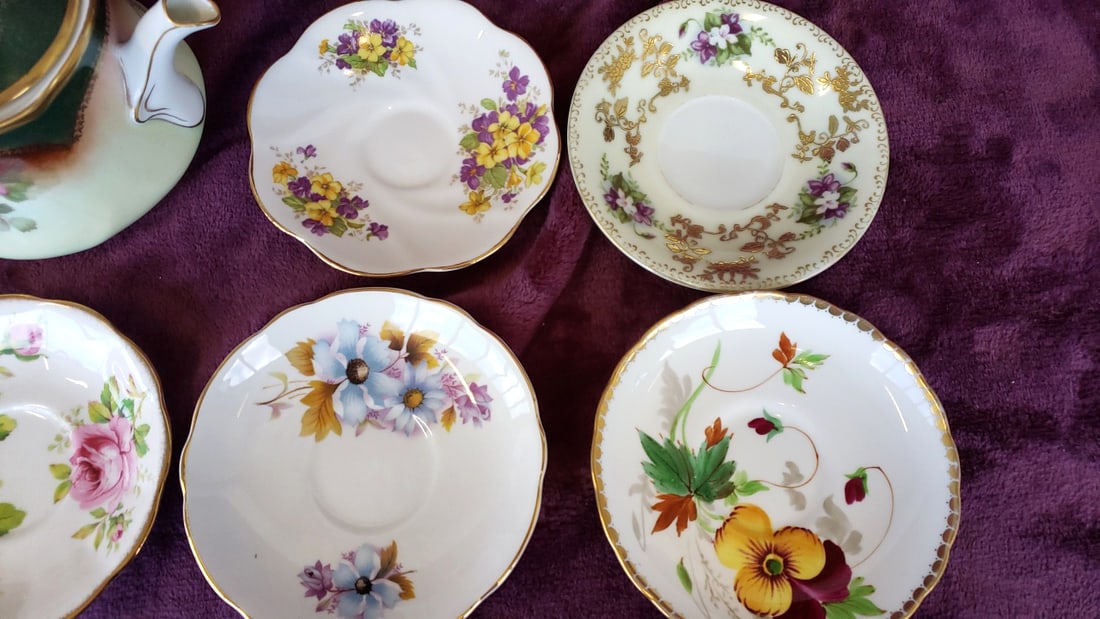 Mixed Floral Bone China Teapot and Saucers, Royal Albert American Beauty, Regency, Louise Bavaria: 12x12x12 4 Low Estimate: 25.00 High Estimate: 75.00