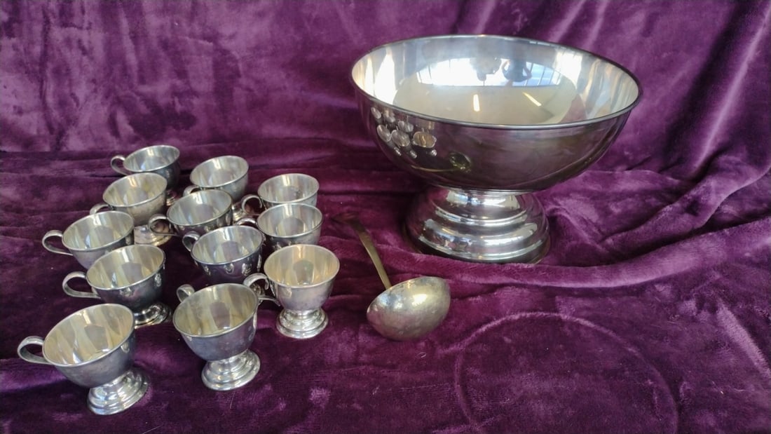 Nickel Silver Footed Punch Bowl Set with Ladle and 12 Handled Cups: 12.5 x 8 x 12.5 6 lb Low Estimate: 50.00 High Estimate: 180.00