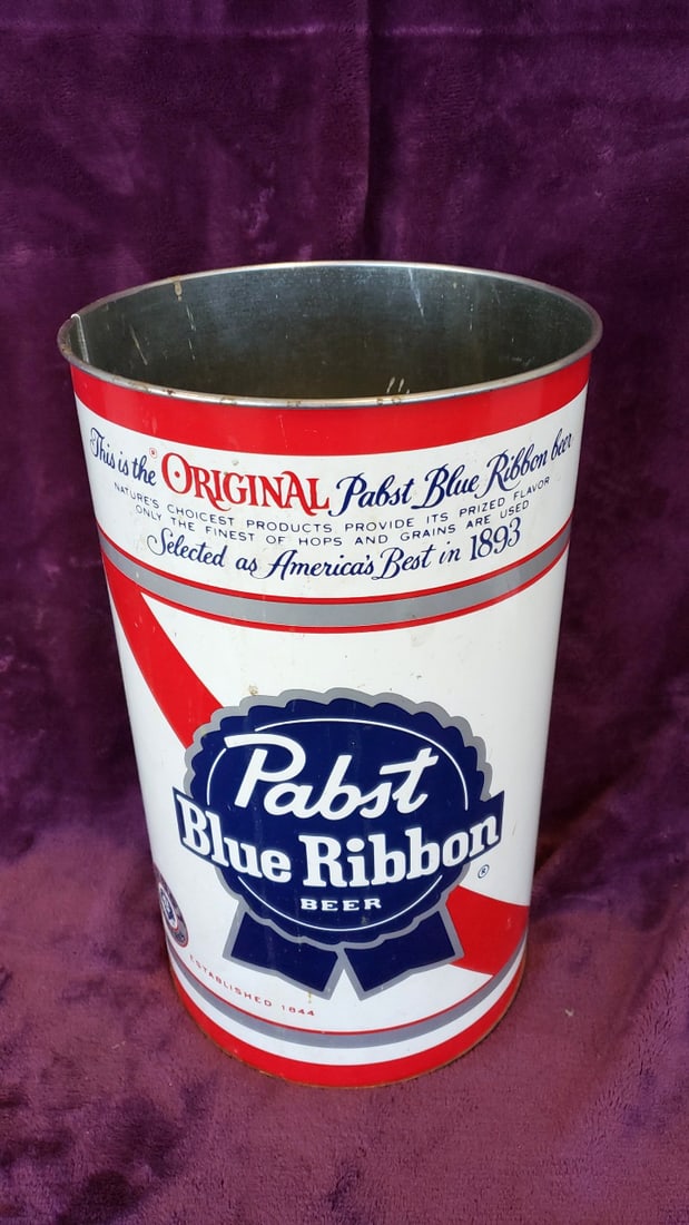 Pabst Blue Ribbon Beer Metal Wastebasket Trash Can by J.L. Clark: 10.5 x 14 x 10.5 1.5 lb Low Estimate: 25.00 High Estimate: 150.00