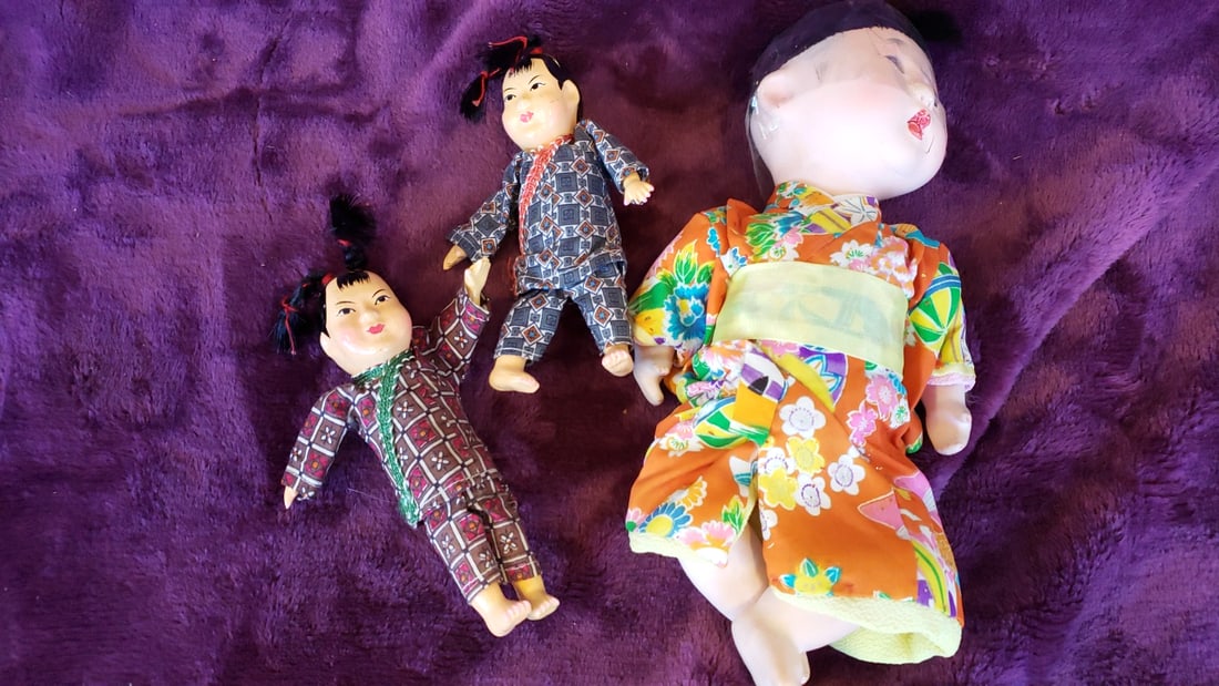 Japanese Kimono Doll Lot, Large Orange Floral Baby Doll with 2 Small Patterned Dolls, 10 in: 9.5 x 8 x 3 0.8 lb Low Estimate: 12.00 High Estimate: 35.00
