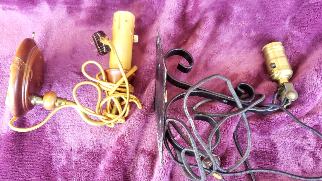 Plug-In Wall Sconce Lamp Lot: Black Wrought Iron & Brown Faux Candle, Cloth Cords: 13 x 8 x 5 3 lb Low Estimate: 12.00 High Estimate: 50.00