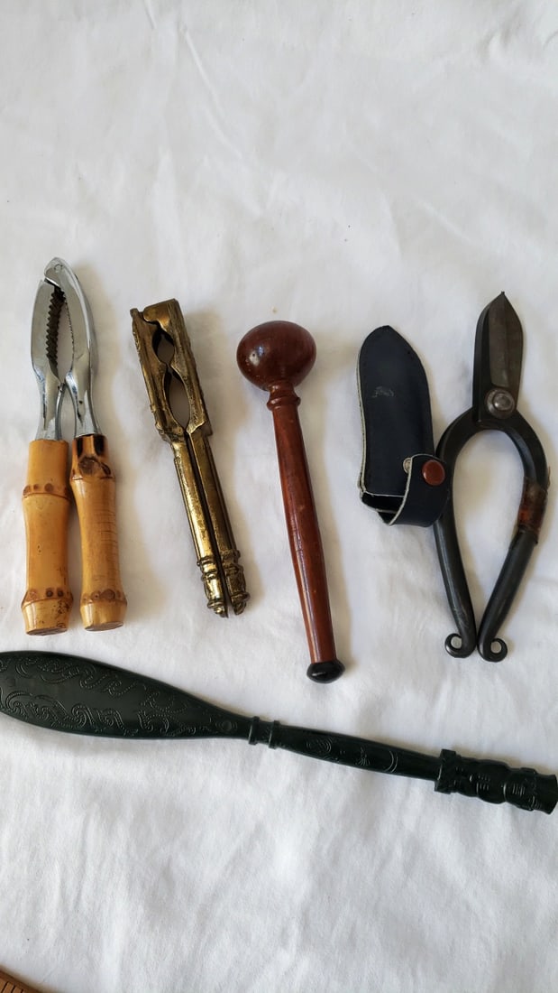 Kitchen Utensil Lot Nutcracker, Brass Tongs, Wooden Muddler, Bonsai Shears: 11 x 11 x 2 2.5 lb Low Estimate: 10.00 High Estimate: 35.00