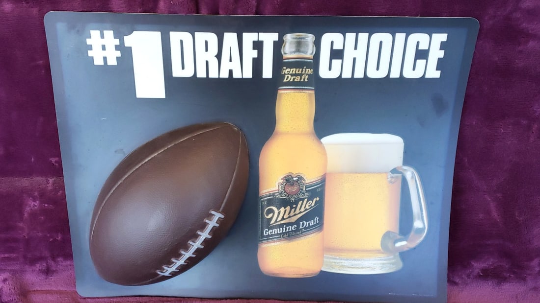 Miller Genuine Draft #1 Draft Choice Football Beer Sign: 22 x 14.5 x 2 2 lb Low Estimate: 20.00 High Estimate: 75.00