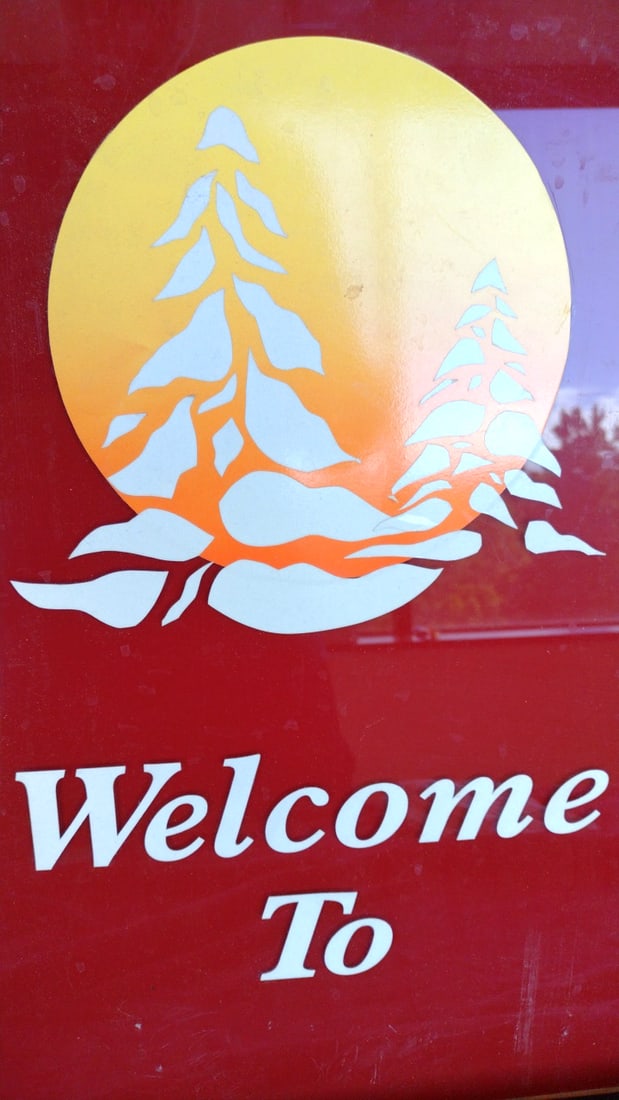 Red Acrylic "Welcome To" Sign with Pine Trees and Sunset Graphic - 2