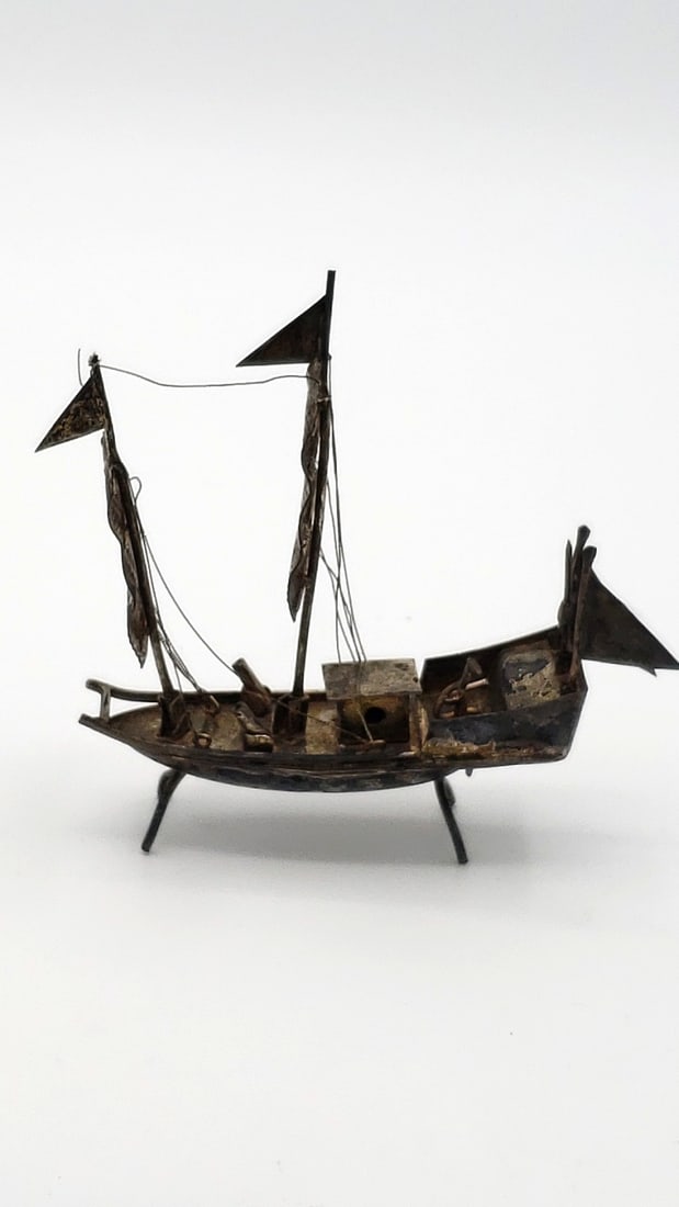 White Metal Sailing Ship Sculpture With Textured Sails And Stand: Unmarked, possibly silver 4x4x4 1 Low Estimate: 15.00 High Estimate: 65.00
