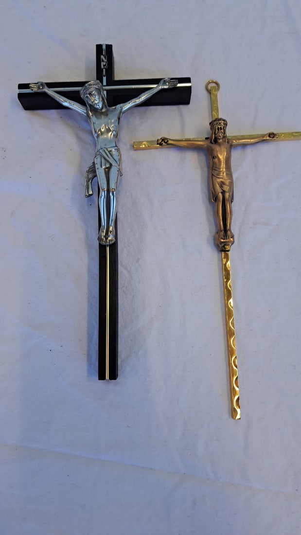 2 Wall Crucifixes, Black Wood Silver-tone Corpus Gold-tone Metal: 10 x 5 x 2in 1lb Low Estimate: 8.00 High Estimate: 25.00