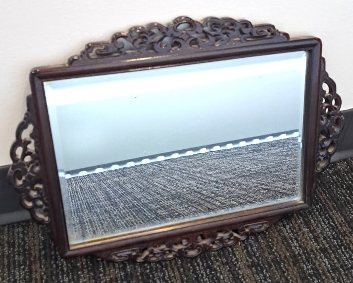 Asian Carved Dark Wood Beveled Mirror With Floral Scroll Frame: 16 x 12 x 1in. 2lb Low Estimate: 75.00 High Estimate: 250.00
