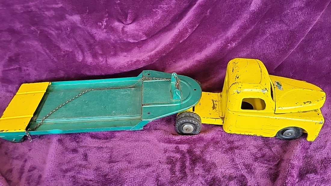 Structo Pressed Steel Toy Truck And Trailer, Yellow And Teal, Approx. 30 In: 27 x 5. 5 x 6 4 lb Low Estimate: 50.00 High Estimate: 250.00