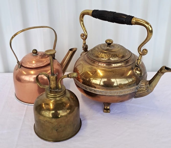 Brass And Copper Kettle, Copper Kettle, Brass Mister: . Ister has a dent small copper kettle is lightweight with small dent in lid. Brass kettle has a dent on base. 12 x 10 x 6in. 3lb Low Estimate: 20.00 High Estimate: 60.00