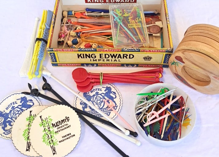 Vintage Cocktail Swizzle Sticks Party Picks Lot In King Edward Imperial Cigar Box Japan Coasters: 8 x 7 x 6in. 1lb Low Estimate: 12.00 High Estimate: 45.00