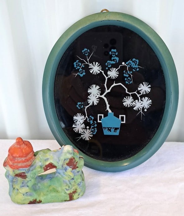 Asian Floral.Silver Blue Picture And Ceramic Pagoda Bridge Decor: The picture has some clear hardened glue or tape. Residue on the front. And the frame needs cleaning. 6 x 5 x 2in. 1lb Low Estimate: 12.00 High Estimate: 45.00