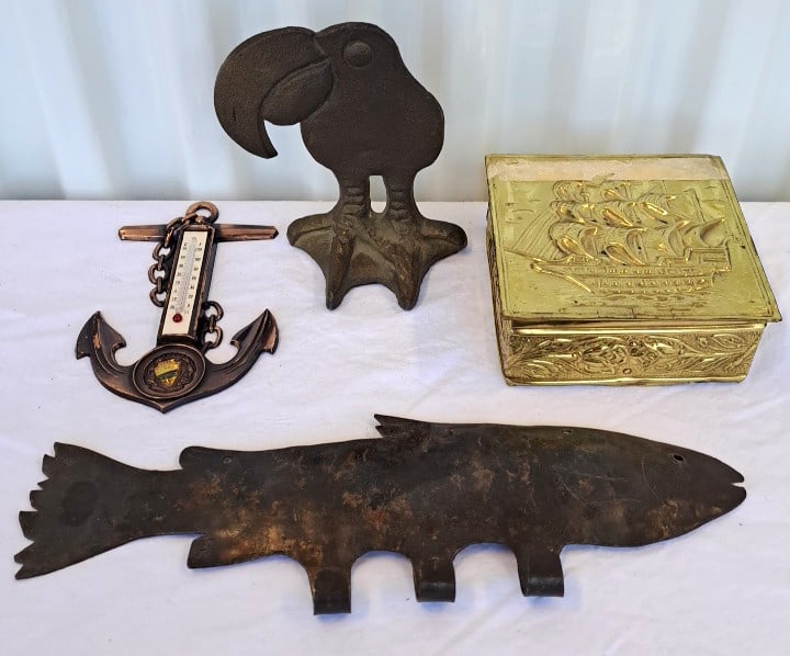 Metal Decor Lot Anchor Thermometer, Brass Ship Box, Fish Hanger Toucan Figure: Hinge on box needs mending. 12 x 9 x 2in. 2lb Low Estimate: 15.00 High Estimate: 55.00