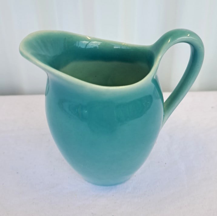 Rookwood Turquoise Glazed Ceramic Creamer: Good condition. 4 x 4 x 3in. 1lb Low Estimate: 40.00 High Estimate: 100.00