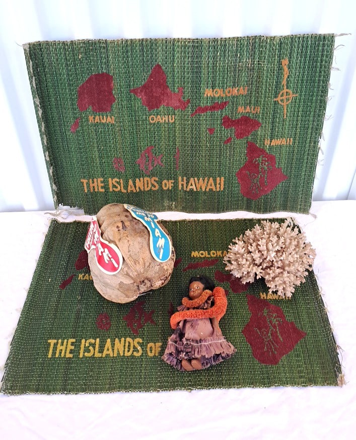 Souvenir Lot Islands Of Hawaii Mats Miami Coconut Hula Doll Coral: Placemats have some stains and damage. 13 x 11 5in. 3lb Low Estimate: 10.00 High Estimate: 35.00