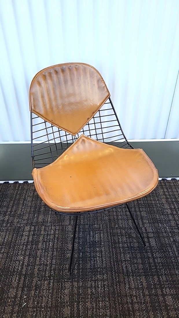 Herman Miller Eames Dkr-2 Style Wire Side Chair With Tan Bikini Pads And Black Eiffel Base: Original seat shows signs of wear. Metal needs to be repaired in one spot. See all photos 19 x 33 x 22 14 lb Low Estimate: 250.00 High Estimate: 600.00