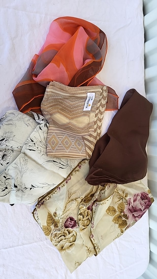 5 Assorted Sheer Scarf Lot Floral Geometric Brown Orange Liz Claiborne: May have small stains or moth nibbles 5 x 4 x 3 1 lb Low Estimate: 10.00 High Estimate: 25.00