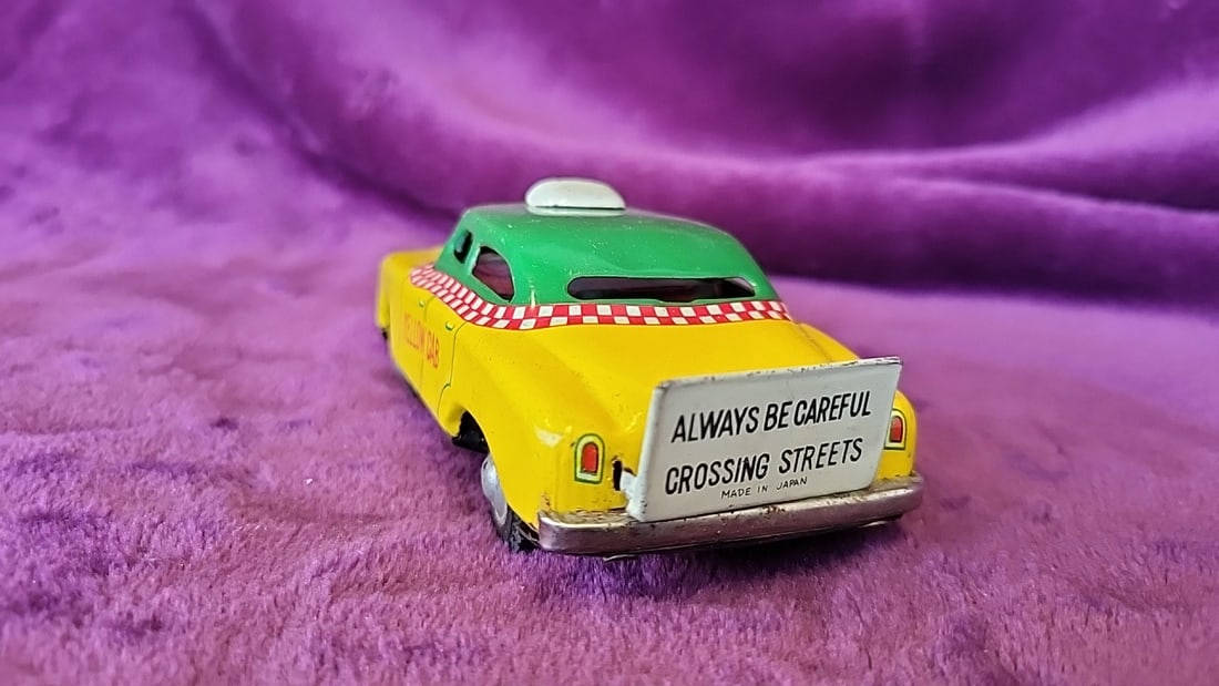 Made In Japan Tin Litho Yellow Cab Taxi Toy With Green Roof And Rear Safety Sign - 3