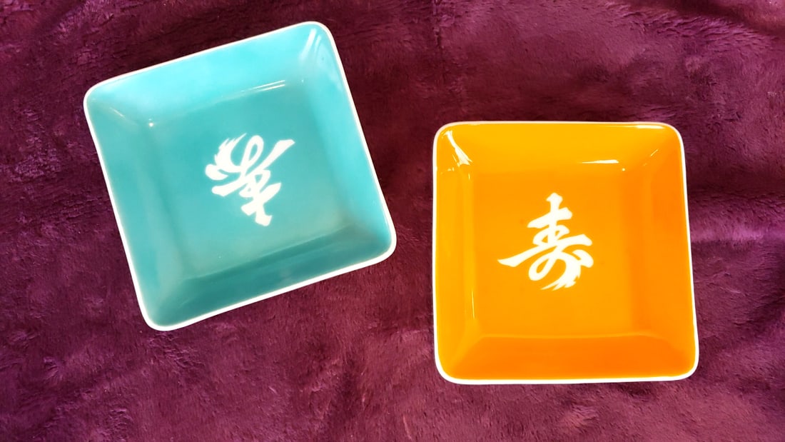 Pair Square Porcelain Sauce Dishes Orange Teal White Characters: 4x4x1 1lb Low Estimate: 5.00 High Estimate: 20.00