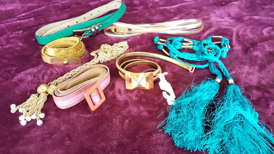 Lot Of Womens Fashion Belts Gold Chain Pink Fabric Teal Braided Tassel Metallic Styles As Is: 11x6x4 1lb Low Estimate: 5.00 High Estimate: 22.00