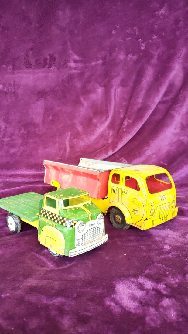 Wyandotte Tin Litho Flatbed Truck Yellow Wolverine White Mustang Dump Truck Toy Lot: 15x6x7 2lb Low Estimate: 30.00 High Estimate: 150.00