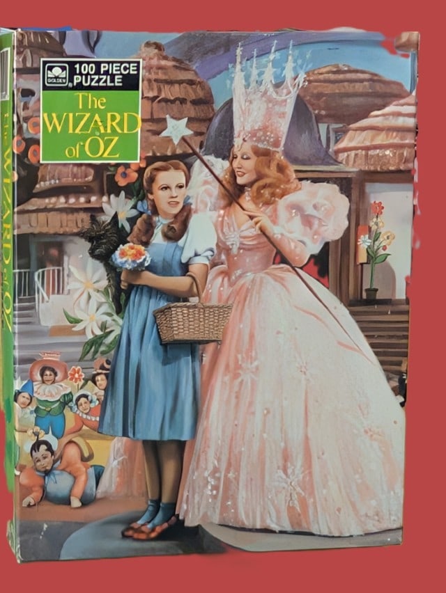 Wizard of Oz 100 Piece Puzzle: Wizard of Oz 100-piece jigsaw puzzle featuring a great scene with Glinda and Dorothy