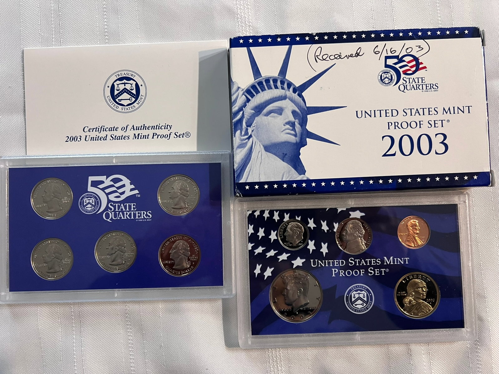 2003 S Proof Set, 10 Coins PR: Proof Set. Lincoln cent, Jefferson nickel, Roosevelt dime, 5 State quarters, Kennedy half dollar & Sacagawea dollar (10 coins), in original packaging and COA included.