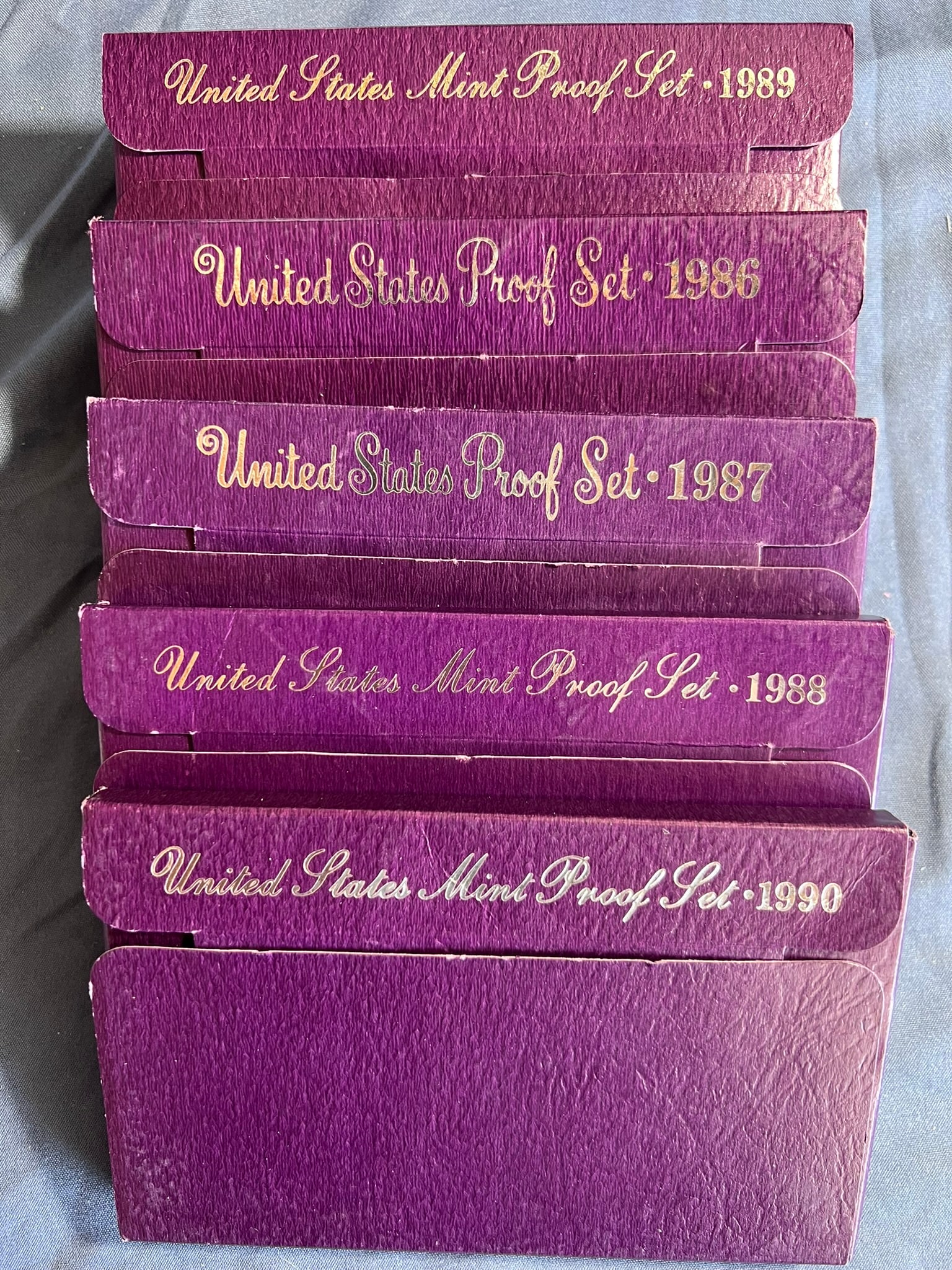 5 US Proof sets, 1986S-1990S 1 for each year: Each proof set has the ff: Lincoln cent, Jefferson nickel, Roosevelt dime, Washington quarter & Kennedy half dollar (5 coins per set). All sealed in original packaging and COA included.