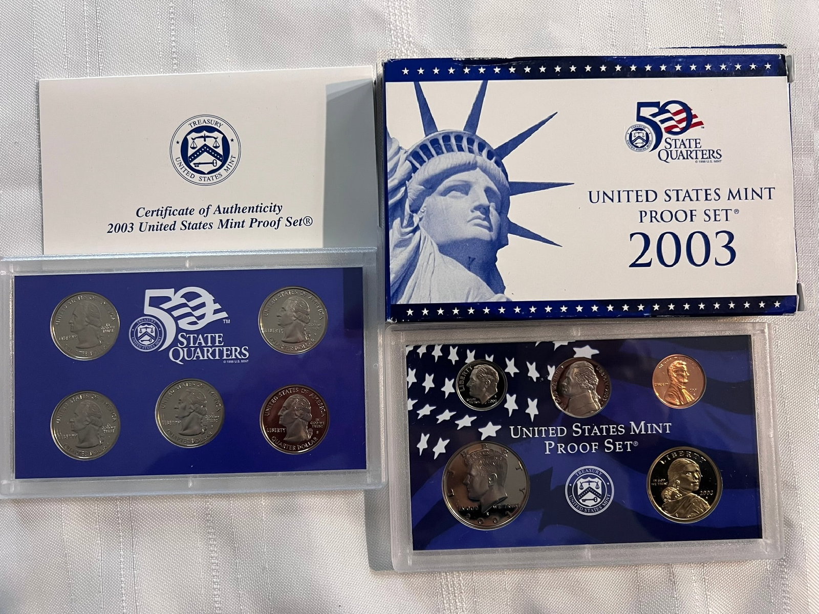 2003 S Proof Set, 10 Coins PR: Proof Set. Lincoln cent, Jefferson nickel, Roosevelt dime, 5 State quarters, Kennedy half dollar & Sacagawea dollar (10 coins), in original packaging and COA included.