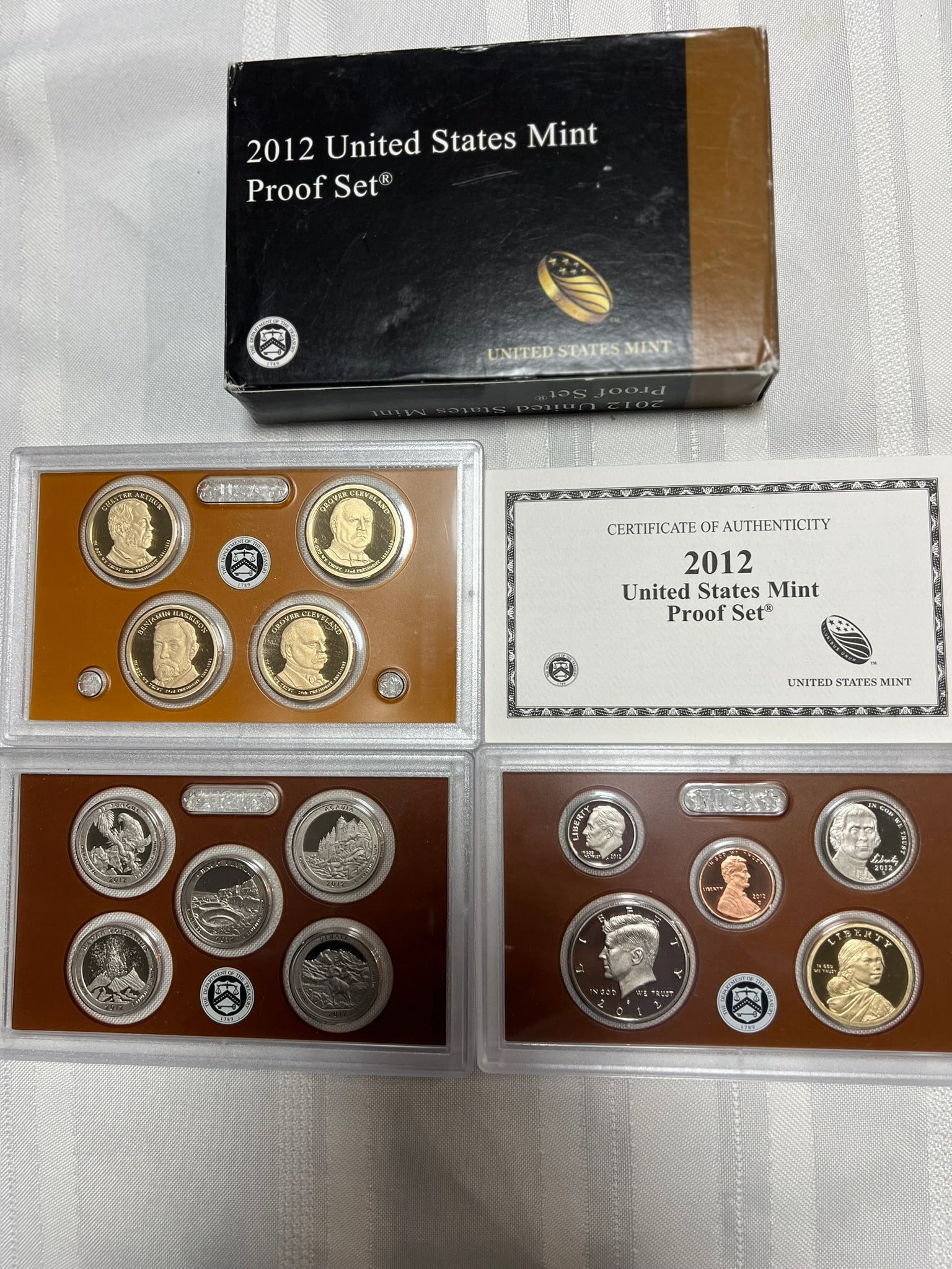 2012 S Proof Set, 14 Coins PR: Proof Set. Lincoln cent, Jefferson nickel, Roosevelt dime, 5 State quarters, Kennedy half dollar, Sacagawea dollar & 4 Presidential dollars (14 coins), in original packaging and COA included.