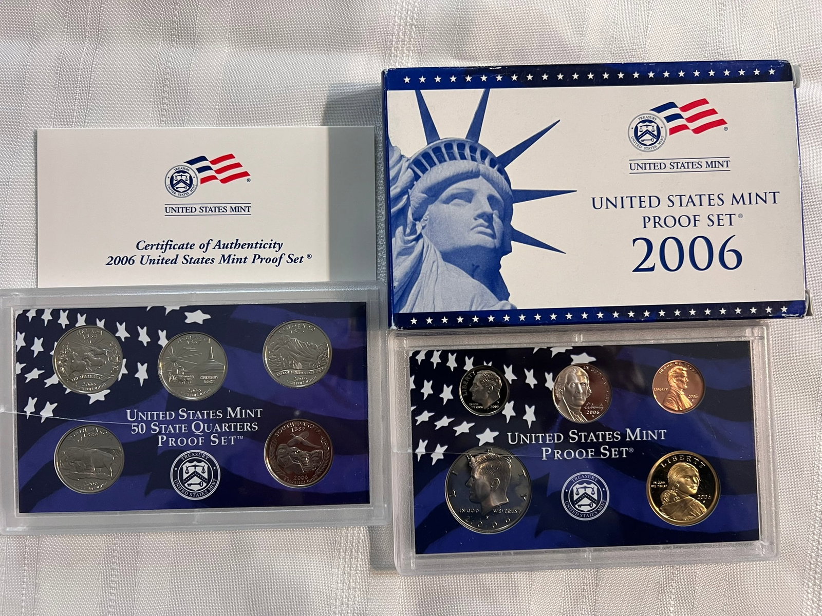 2006 S Proof Set, 10 Coins PR: Proof Set. Lincoln cent, Jefferson nickel, Roosevelt dime, 5 State quarters, Kennedy half dollar & Sacagawea dollar (10 coins), in original packaging and COA included.