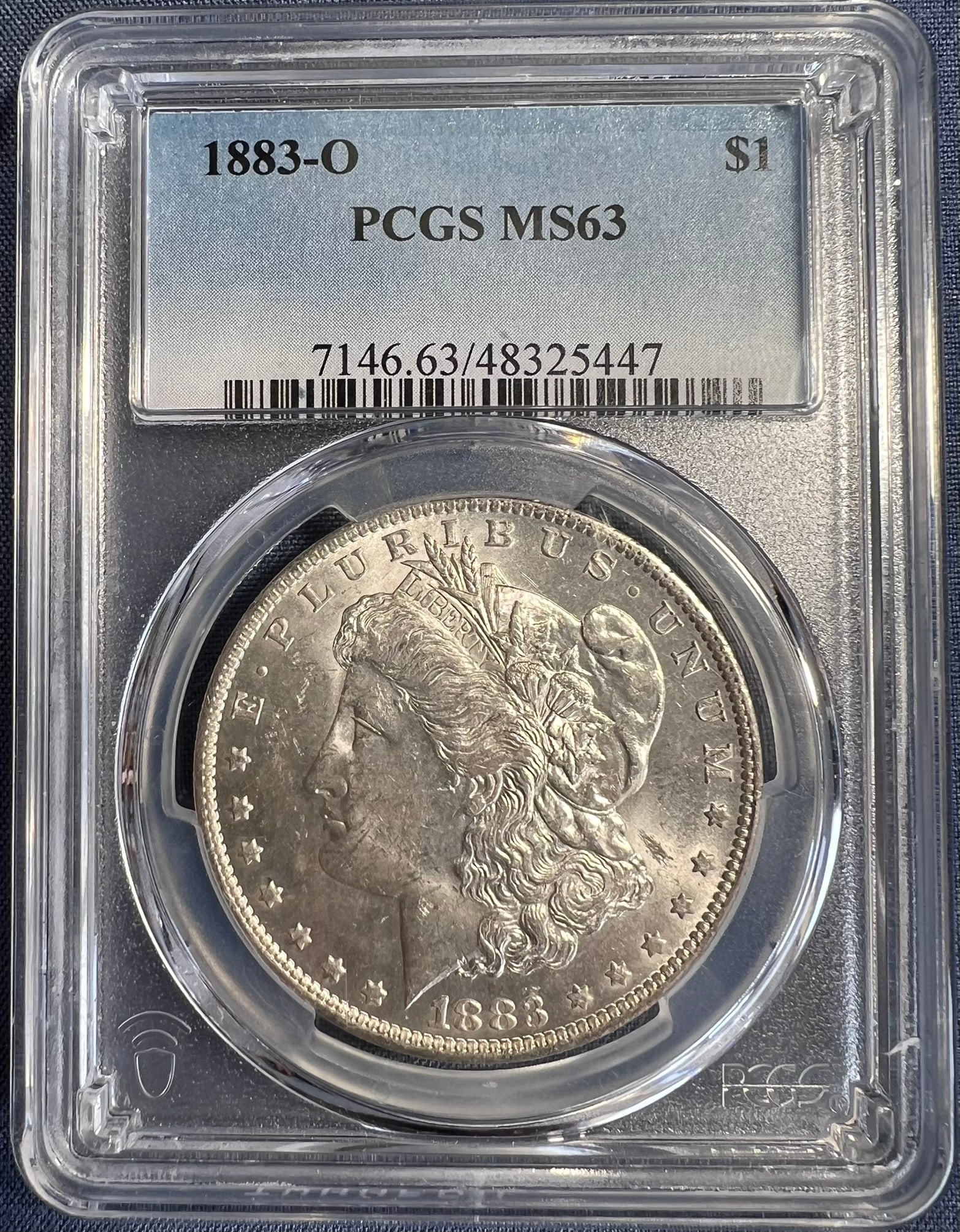 1883-O Morgan Silver Dollar $1 NGC MS63: The product is a 1883-O Morgan Silver Dollar $1 graded MS63 by PCGS. It is a circulated silver coin with a fineness of 0.9, minted in New Orleans. This coin has been certified by PCGS, showcasing its