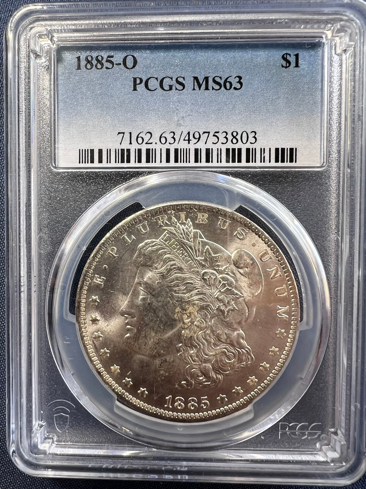 1885-O Morgan Silver Dollar $1 NGC MS63: The product is a 1885-O Morgan Silver Dollar $1 graded MS63 by PCGS. It is a circulated silver coin with a fineness of 0.9, minted in New Orleans. This coin has been certified by PCGS, showcasing its