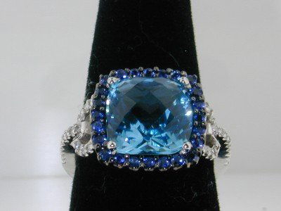 14k White Gold Blue Topaz Sapphire Diamond Ring: This is a Wonderful 14k White Gold Blue Topaz Sapphire Diamond Ring !The total ring's weight is 6.3 grams.The total diamonds weight is 0.30 ct. approximately, I color SI clarity.The total weight of Sa