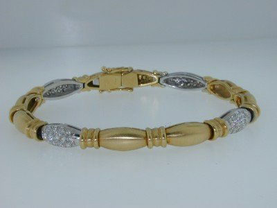 18K Two Toned Diamond Bracelet: 18K Two Toned (Yellow-White) Gold Diamond Bracelet. The bracelet's weight is 20.5 grams. The total weight of diamonds is 1.5 ct approximately G color VVS clarity. The bracelet 7" long. width: 5 mm, th