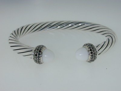 David Yurman Silver, White Coral, Black Diamond Ba: David Yurman Silver, White Coral & Black Diamond Bangle. The total Bangle's weight is 32.7 grams. The total Black diamond weight is 30 pts approximately. The size of white coral : 9 mm The measurement