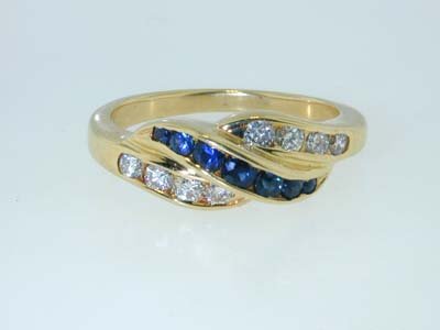 Tiffany & Co. Sapphire and Diamond Ring: Tiffany & Co. Sapphire and Diamond Ring 40 pt Diamond G Color VVS Clarity. 25 pt Sapphire. The weight of the ring is 6.2 g. The whe ring is 6.5. 100% Authentic Tiffany & Co. also has signature.