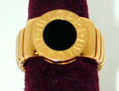 BVLGARI 18K Yellow Gold Ring with Onyx: BVLGARI 18K Yellow Gold Ring with Onyx, the total weight is 18.7 g, the size of the ring is 5.5 , there is the Bvlgari stamp and serial # inside in the ring and this is the 100% authentic Bvlgari ring