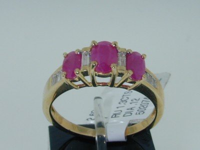 10k Yellow Gold Ruby & Diamond Ring: 10k Yellow Gold Ruby & Diamond Ring. The total ring's weight is 2.6 grams. The total diamond weight is 12 pts,approximately. H color, VS clarity. The total Ruby weight is 1.3 cts approximately.The mea