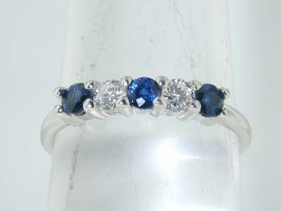 Tiffany & Co. Platinum Diamond and Sapphire Ri: Tiffany & Co. Platinum Diamond and Sapphire Ring Approximatly 20 pt diamond, G Color, VS Clarity. Approximatly 30 pt sapphire. The weight of the ring is 3.4 g. The size of the ring is 6.