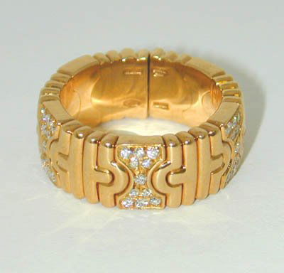 BVLGARI 18K Yellow Gold Ring w/ Diamonds: BVLGARI 18K Yellow Gold Ring w/ Diamonds, the total weight is 14.9 g , the size of the ring is 7, the total diamond weight is 0.55 cts, G color VS clarity. There is the Bvlgari stamp and serial # in