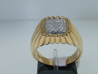 14K Two-Tone Gold Diamond Men's Ring: 18K Two-tone Gold Diamond Men's Ring,The total ring's weight is 9.9 grams.The total weight of diamonds is 40 pts. approximately, G color VS clarity.The measurement of the ring's surface is 19x13 mm an